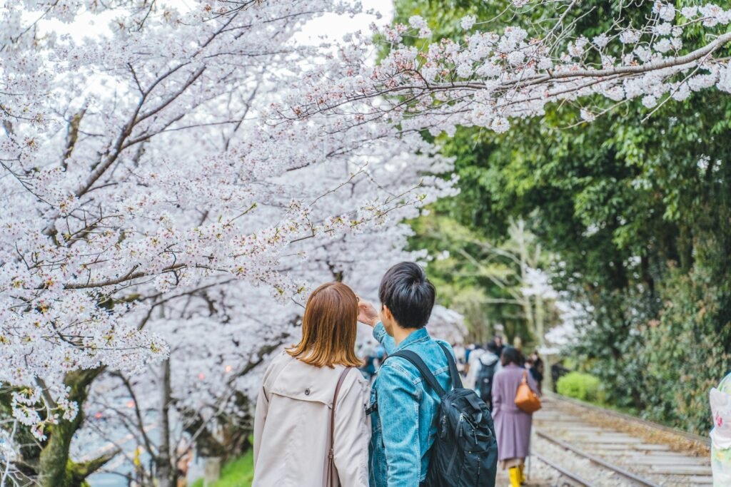 a couple of people that are standing in the grass